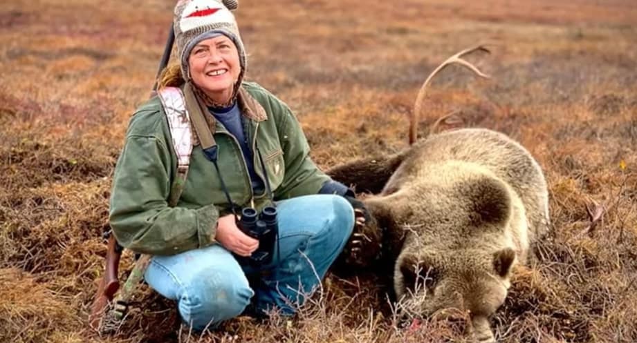 Image of Sue Aikens and the bear that attacked her