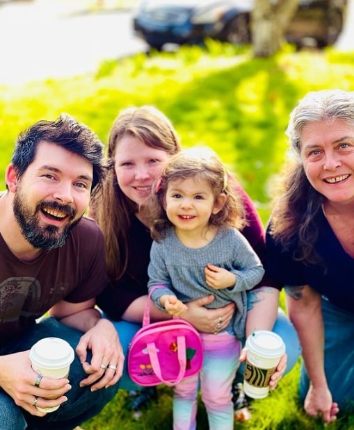 Image of Sue Aikens with her son, Jesse, grand daughter Amelia