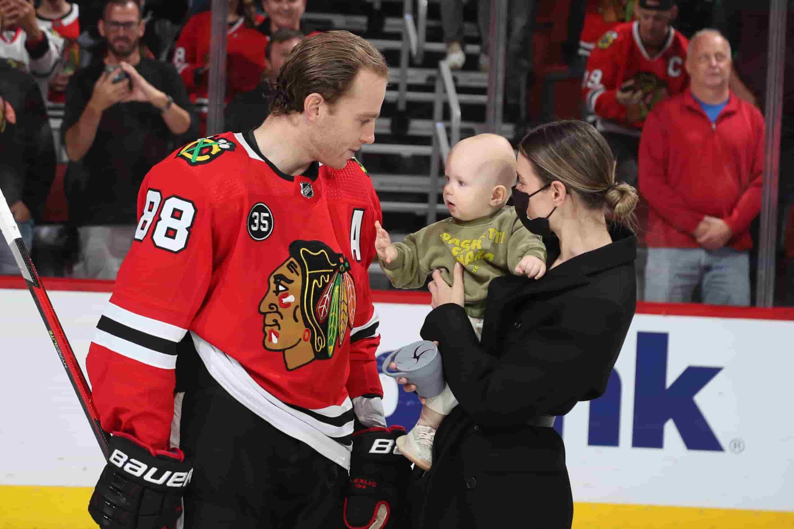 Image of Patrick Kane with his wife, Amanda Grahovec, and their son