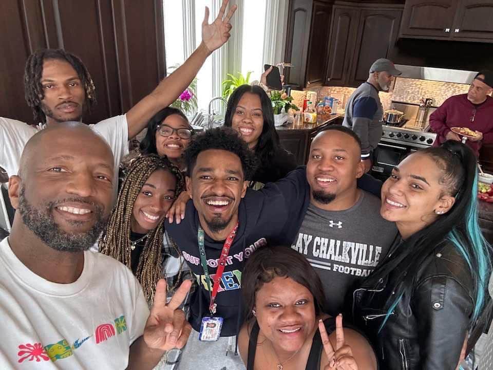 Image of Rickey smiles with his family